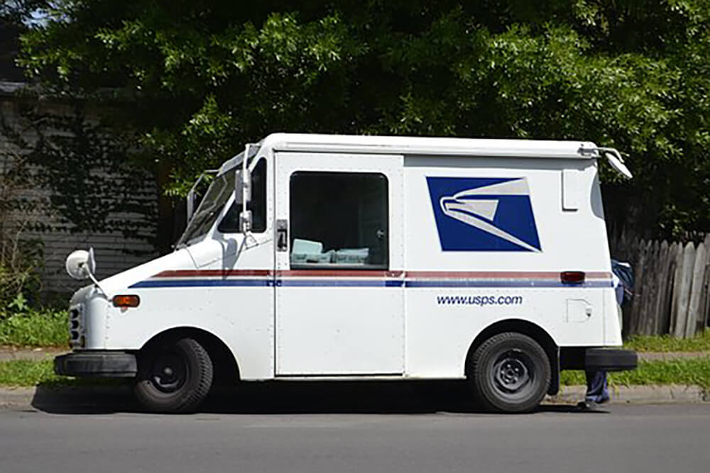 Parked USPS mail carrier