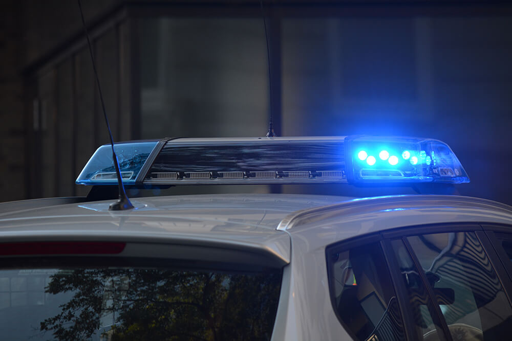 Top of police car with blue siren