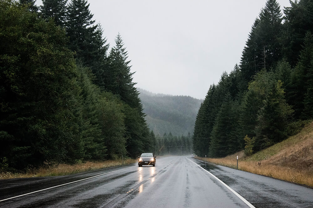 Car on slick road on a cloudy day
