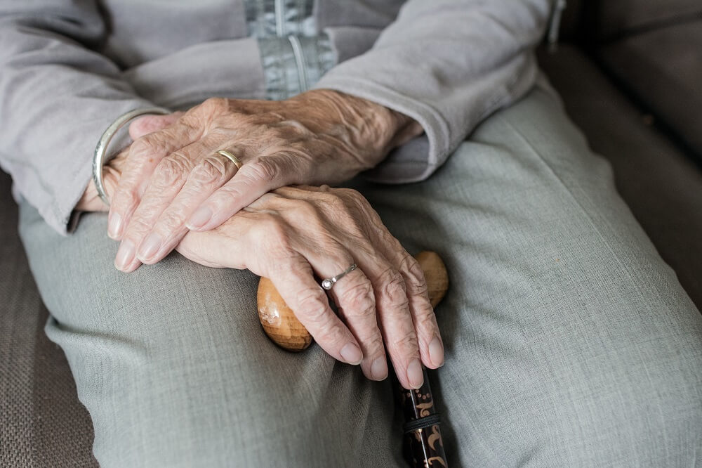 senior citizen with crossed hands